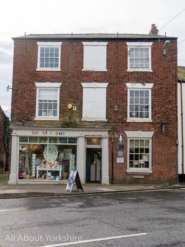 William Bradley's House in Market Weighton. Red brick double fronted detached Georgian house that is now a shop.